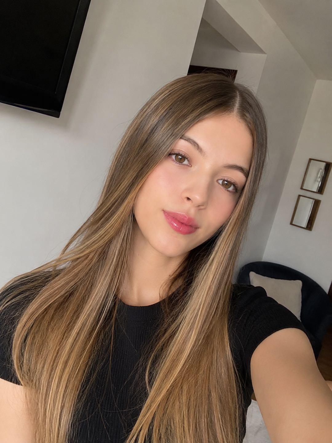 Blonde woman in a black top, online girl preview