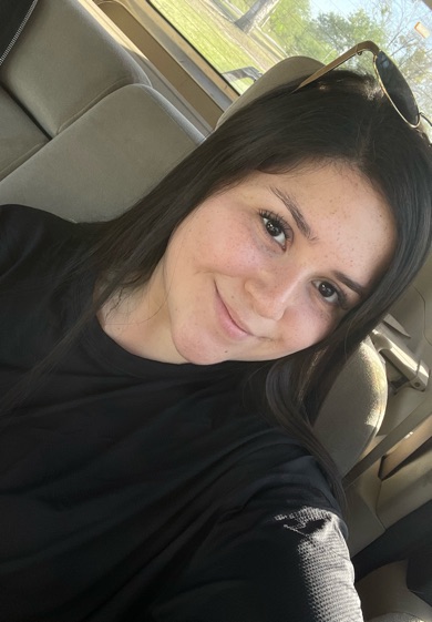 Lexi smiling at the camera