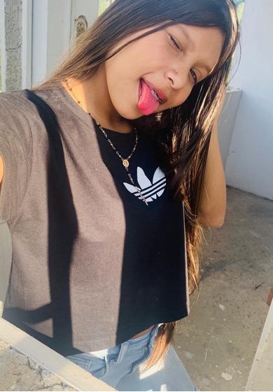 Ale with a playful smile, flirty chat mood