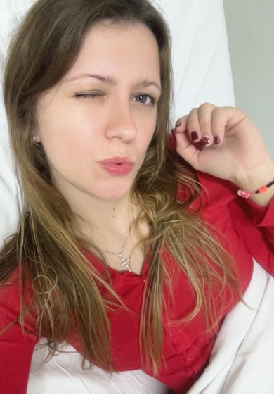 Woman looking into the camera, text or video step