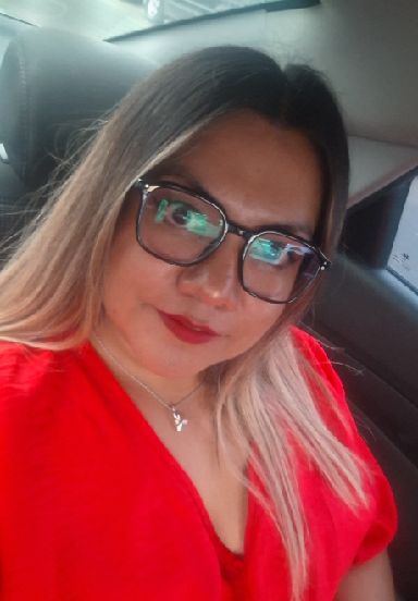 Adult woman wearing glasses in a natural daylight portrait