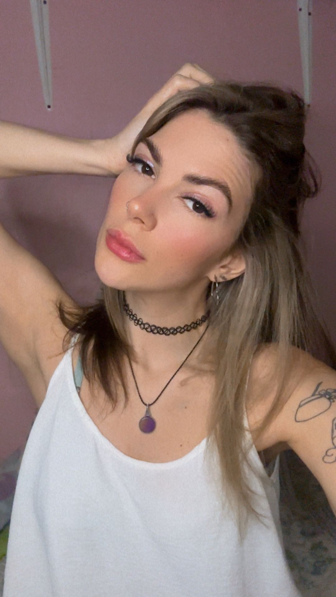 Woman facing the camera against a simple wall, used for a first video-chat checklist