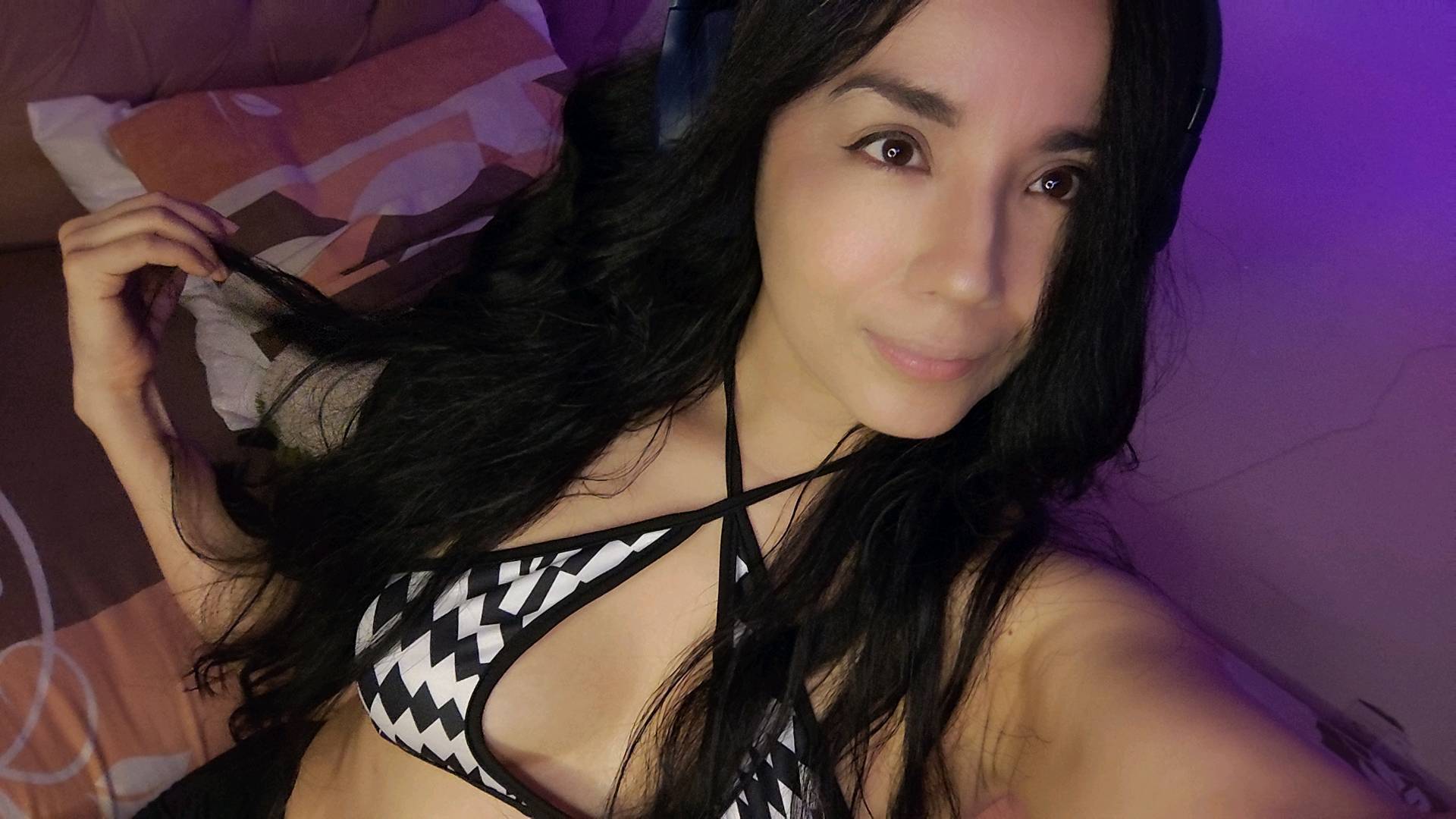 ale in violet light during a private video preview